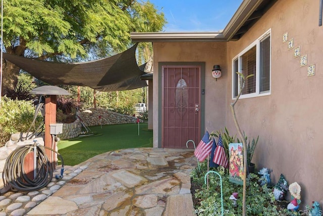 property entrance with a patio area