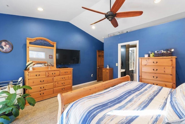 carpeted bedroom featuring ceiling fan, ensuite bathroom, and vaulted ceiling