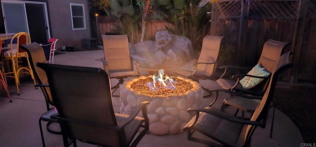 view of patio / terrace with an outdoor fire pit