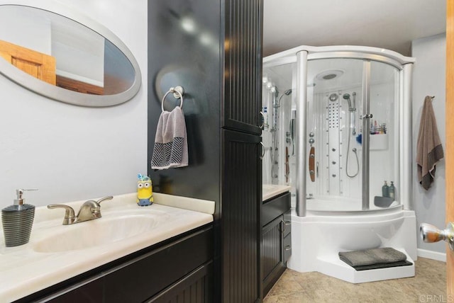 bathroom featuring tile patterned flooring, vanity, and bath / shower combo with glass door