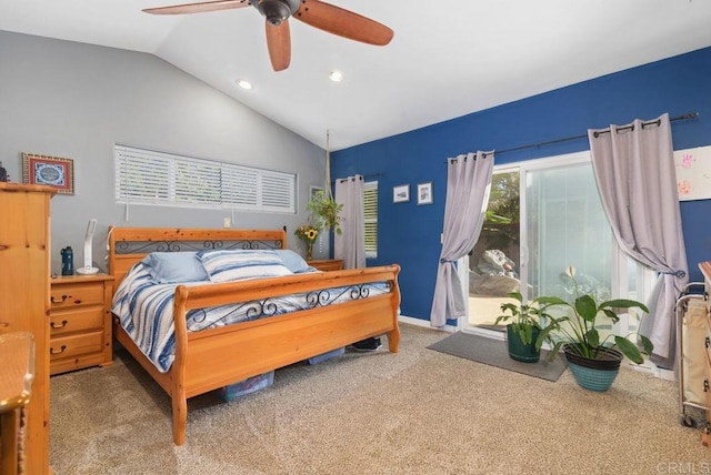 carpeted bedroom with ceiling fan and vaulted ceiling