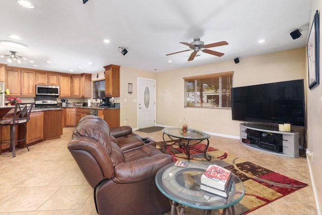 tiled living room featuring ceiling fan