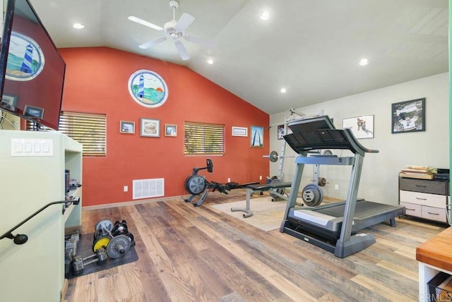 exercise area with hardwood / wood-style flooring, ceiling fan, and vaulted ceiling