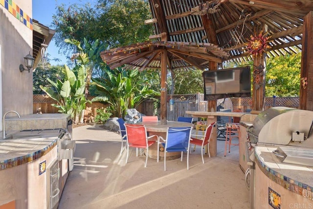 14429 Springvale St, Poway, CA 92064 - view of patio / terrace featuring outdoor dining area, area for grilling, a fenced backyard, and a bar
