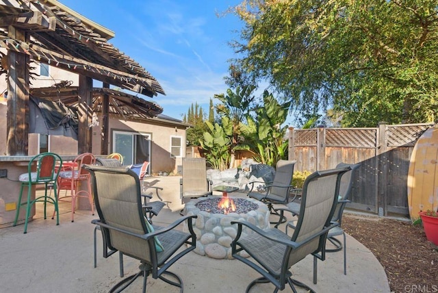 14429 Springvale St, Poway, CA 92064 - view of patio / terrace with a pergola, a fire pit, a fenced backyard, and outdoor dry bar
