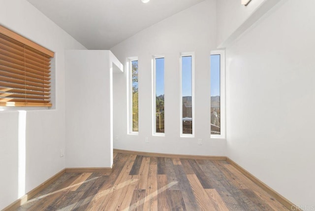 14429 Springvale St, Poway, CA 92064 - spare room with baseboards, wood finished floors, and vaulted ceiling