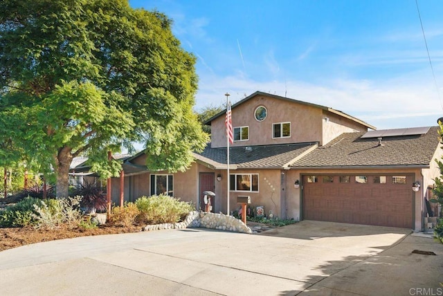 14429 Springvale St, Poway, CA 92064 - traditional-style house featuring a garage, stucco siding, a shingled roof, concrete driveway, and roof mounted solar panels