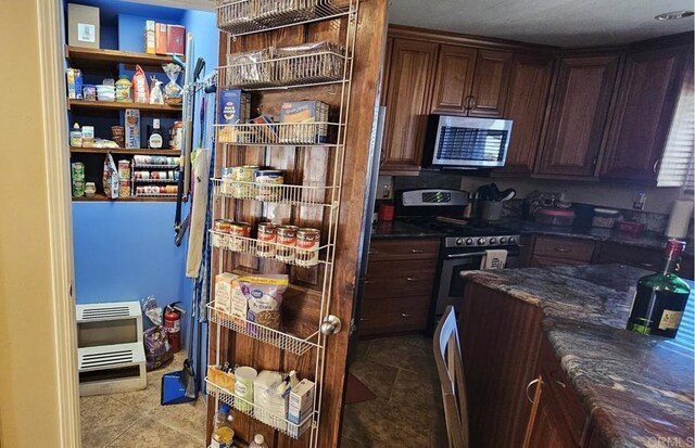 14429 Springvale St, Poway, CA 92064 - kitchen with open shelves, appliances with stainless steel finishes, light tile patterned flooring, and heating unit