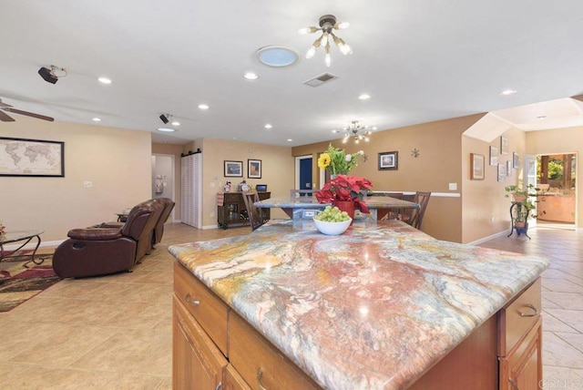 14429 Springvale St, Poway, CA 92064 - kitchen with baseboards, open floor plan, visible vents, and a center island