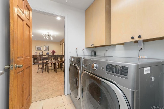 14429 Springvale St, Poway, CA 92064 - laundry area featuring cabinet space, light tile patterned floors, and washer and dryer