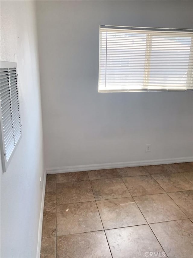 view of tiled spare room