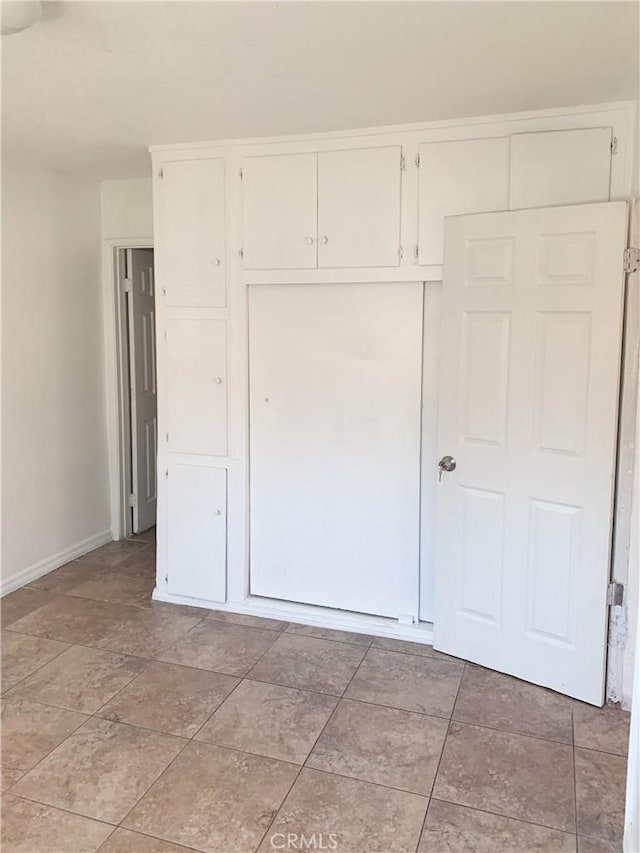 unfurnished bedroom with a closet