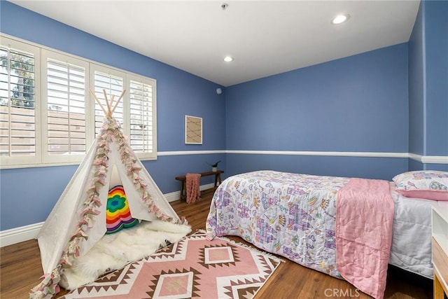 bedroom featuring hardwood / wood-style floors