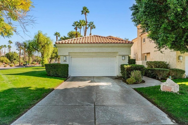 mediterranean / spanish-style house with a garage and a front yard