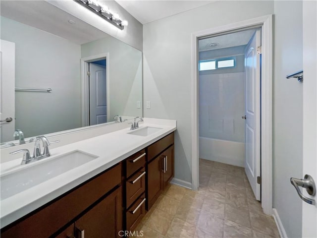 bathroom featuring shower / bathing tub combination and vanity