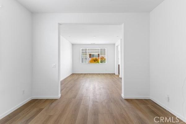 unfurnished room with light hardwood / wood-style floors