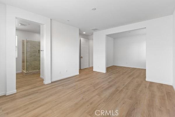 interior space with a closet and light hardwood / wood-style flooring