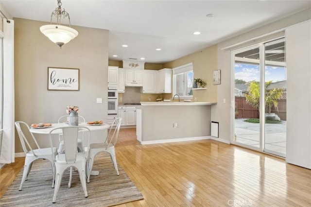 dining room with light hardwood / wood-style floors