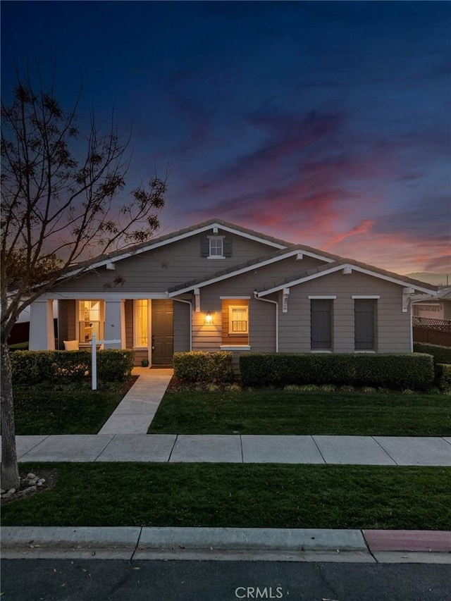 view of front of house with a yard