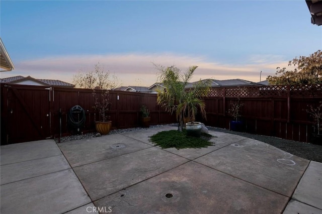 view of patio terrace at dusk