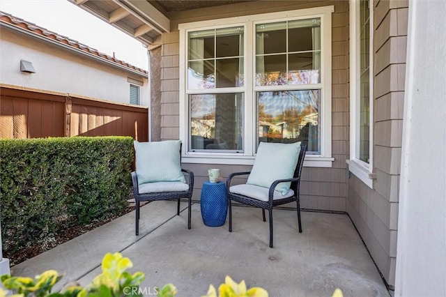 view of patio featuring fence