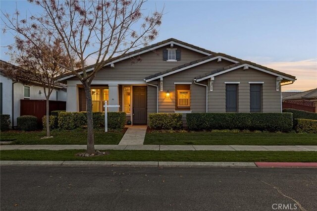 view of front of property with a yard