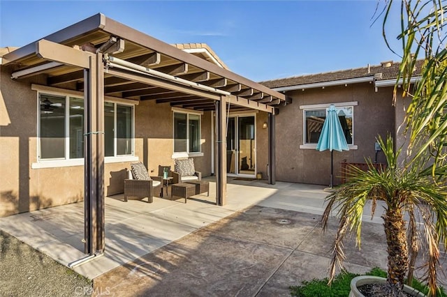 rear view of property featuring a patio area