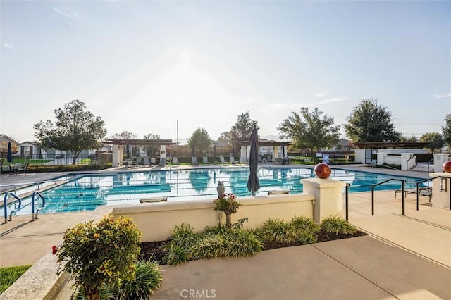 view of pool featuring a pergola and a patio