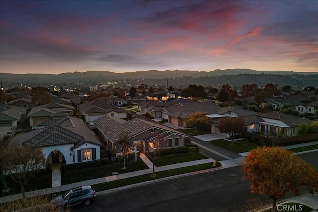 aerial view at dusk with a mountain view