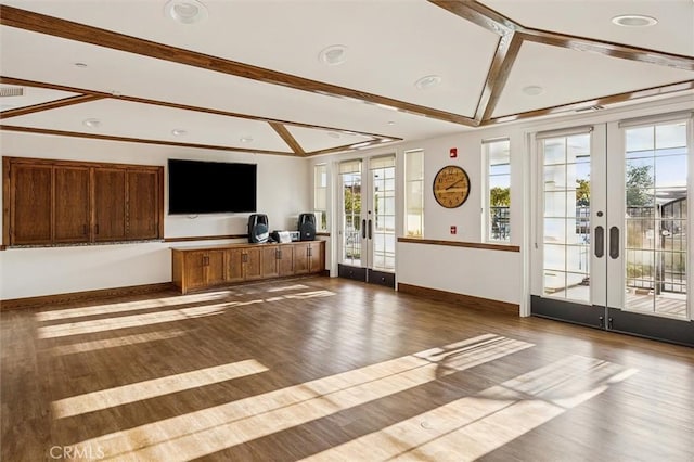 interior space with hardwood / wood-style floors, lofted ceiling with beams, and french doors