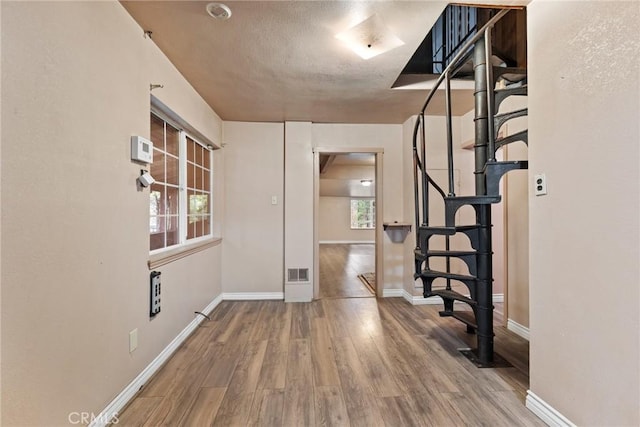 interior space with hardwood / wood-style floors