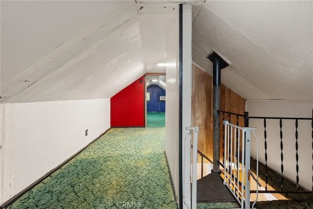 bonus room featuring carpet floors and vaulted ceiling