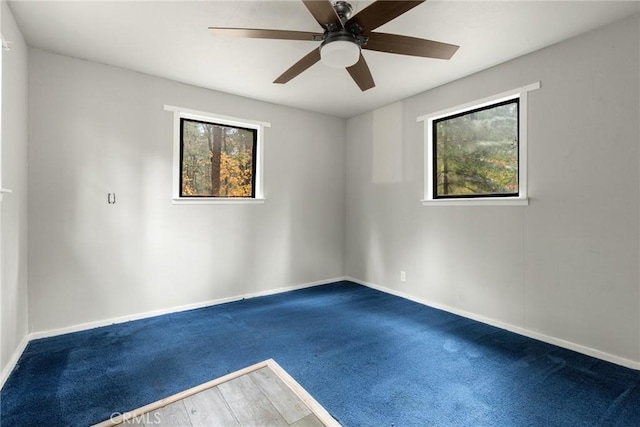 unfurnished room with ceiling fan and carpet floors