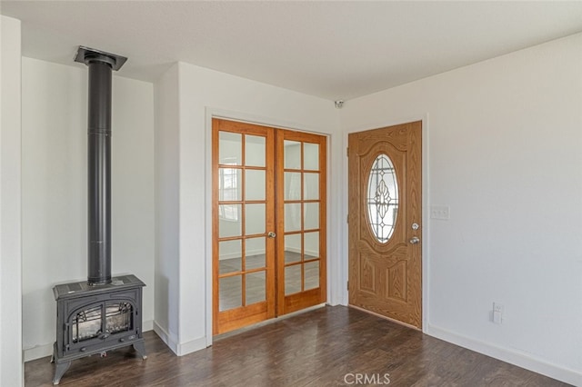 entryway with dark hardwood / wood-style floors and french doors