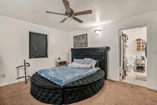 bedroom featuring ensuite bath, ceiling fan, and light colored carpet