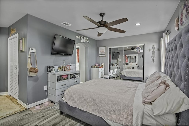 bedroom featuring hardwood / wood-style flooring and ceiling fan