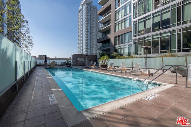 view of swimming pool featuring a patio