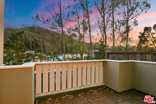 view of balcony at dusk