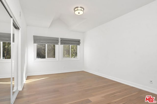 spare room featuring hardwood / wood-style flooring