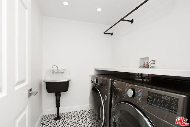 laundry area featuring washer and dryer and sink