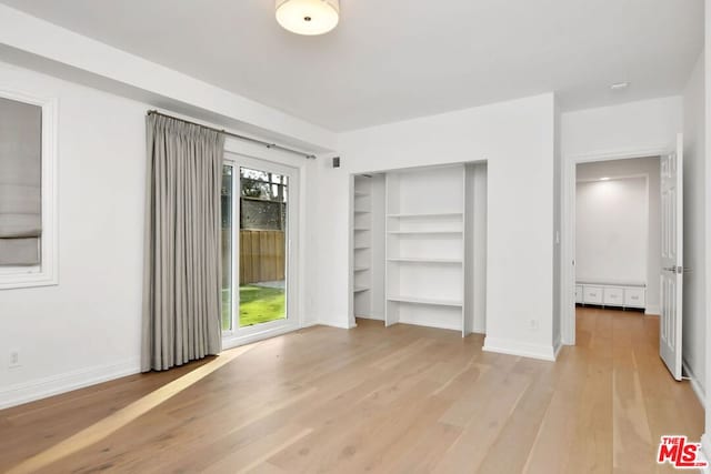 unfurnished bedroom with light hardwood / wood-style floors