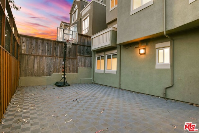 view of patio terrace at dusk