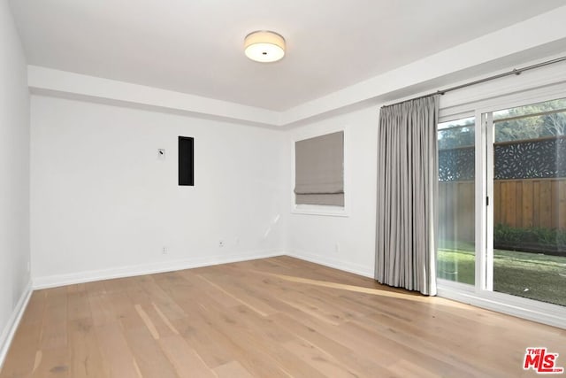 spare room with light wood-type flooring