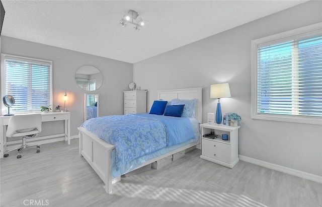 bedroom with light hardwood / wood-style flooring