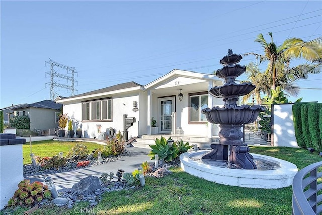 view of front facade with a front lawn