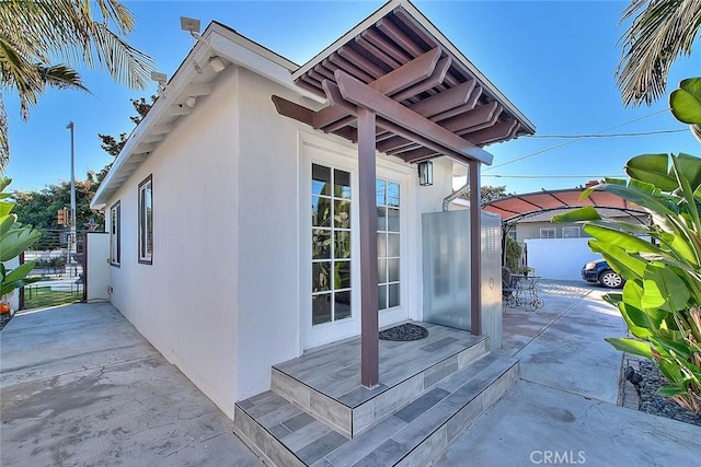 view of side of property featuring a patio area