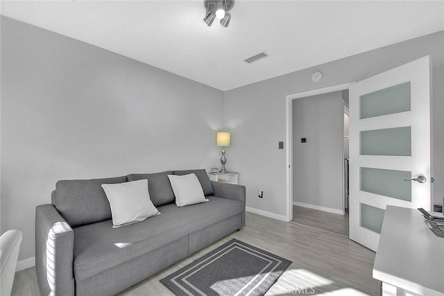 living room with light hardwood / wood-style floors