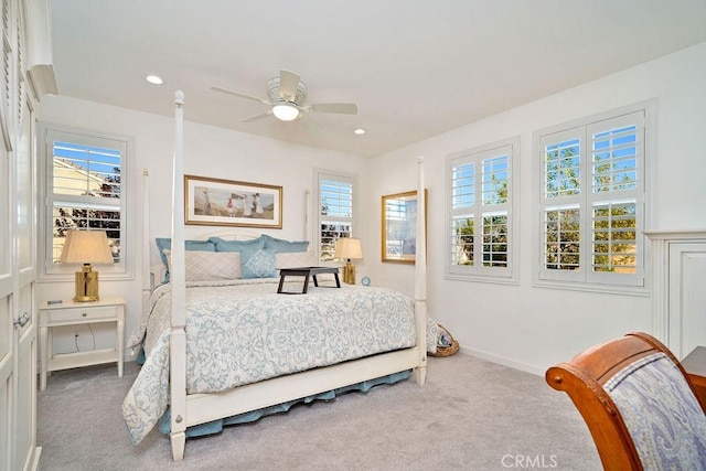 carpeted bedroom featuring ceiling fan