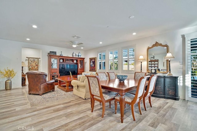 dining space featuring ceiling fan and light hardwood / wood-style flooring