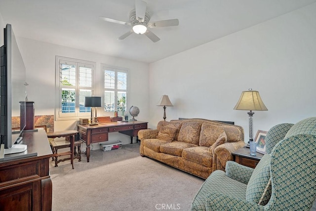 living room featuring light colored carpet and ceiling fan